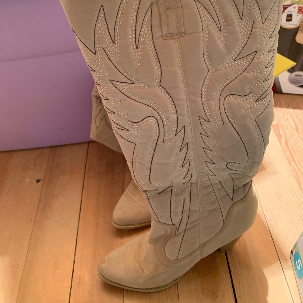 Above the knee cowgirl style heel.